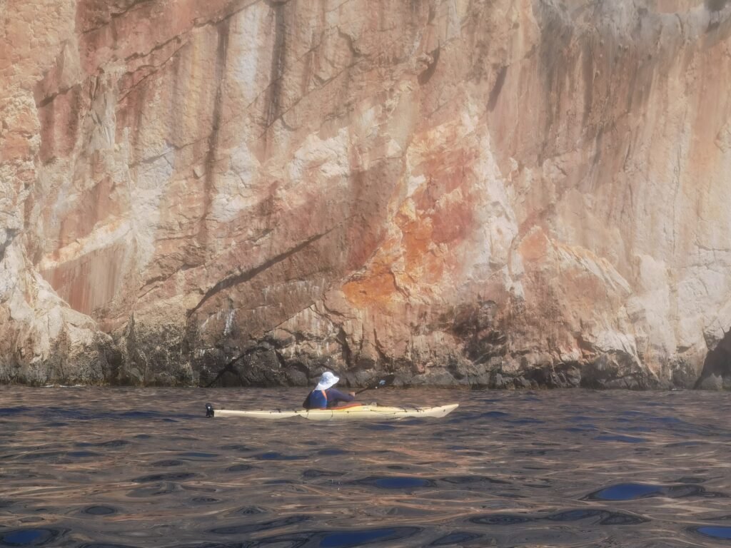 Sea kayaking along the south coast of Hvar, Croatia